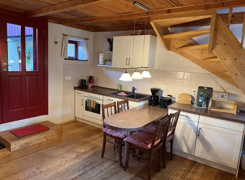 Living area, with fitted kitchen and dining area